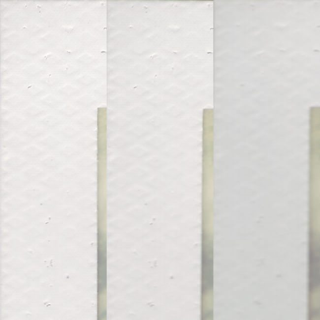 Detail des weißen Rands eines Polaroids in unterschiedlicher Schärfe.